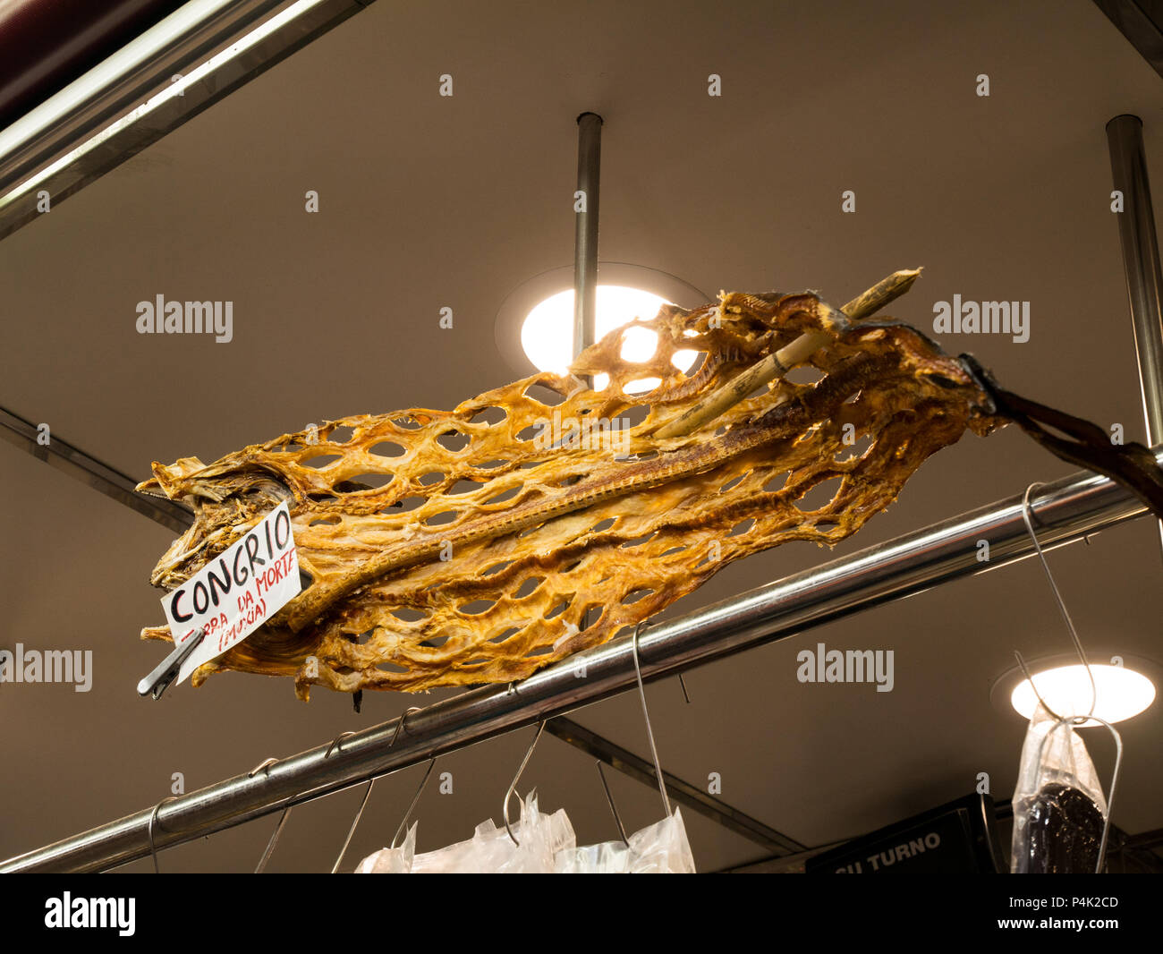 Dried hanging shark and a stall at the central market in Valencia, Spain Stock Photo