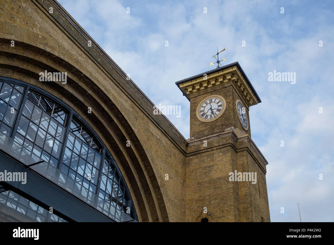 Kings Cross Station London 120 ft. high clock tower with 9 ft. diameter clock dials. Horizontal. Copy space. Stock Photo