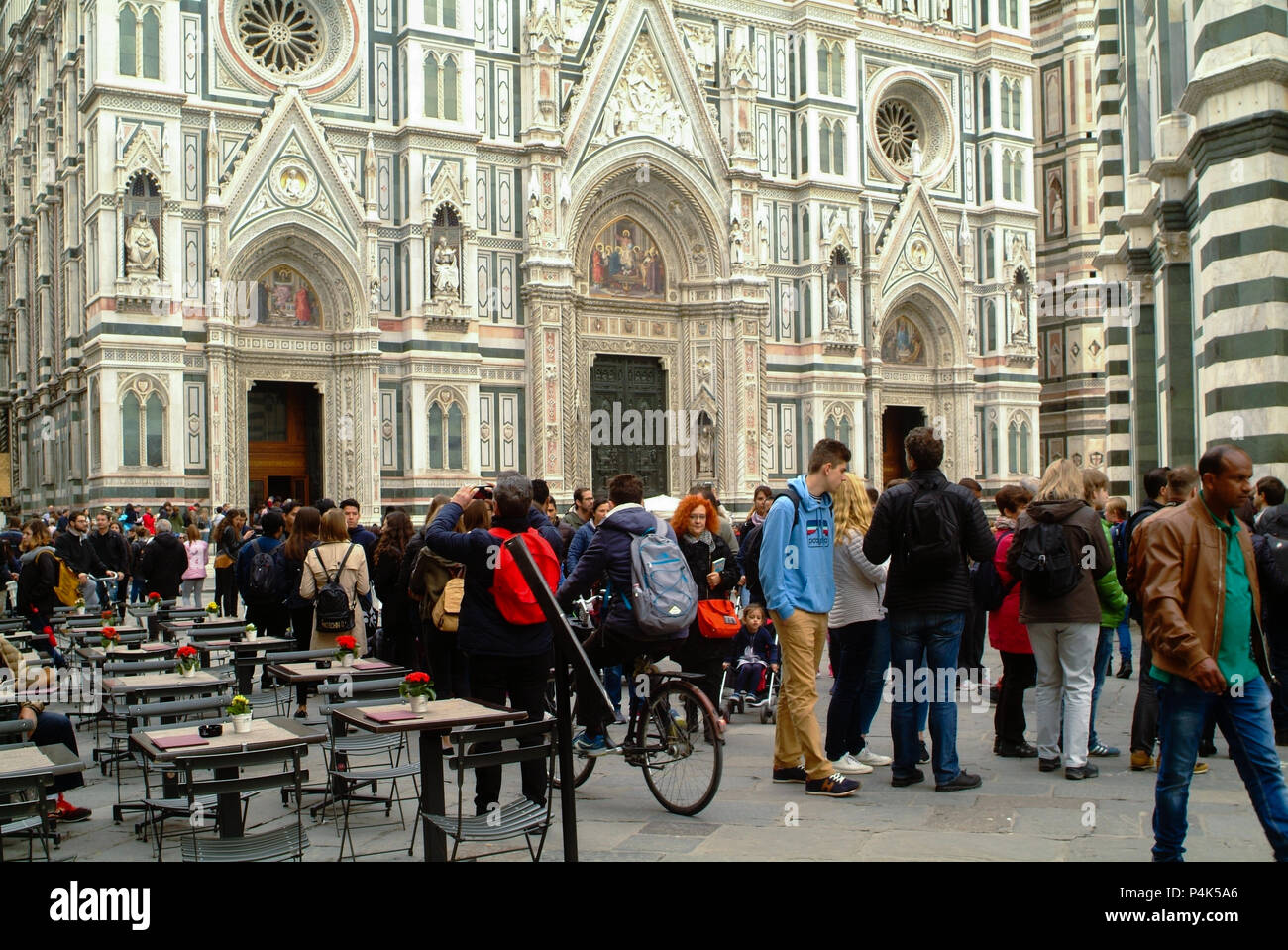 Florence, Italy - circa Spring 2018 - International tourists crowd visiting Santa Maria del Fiore, Florence Italy dome. Cloudy day Stock Photo