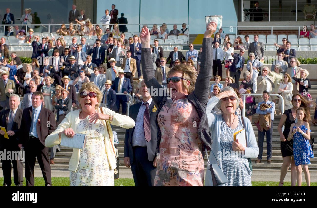 Racegoers react at the end of a horse race at Goodwood race course, near Chichester in Britain on May 26, 2018 Stock Photo
