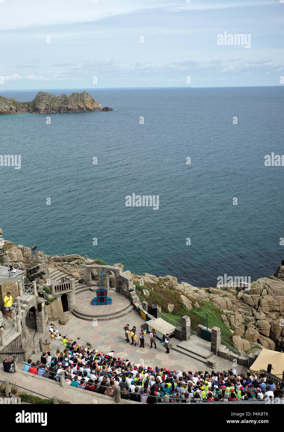 Members of the audience watch a performance at the Minack Theatre, in Porthcurno, near Land's End in Cornwall, Britain June 13, 2018 Stock Photo