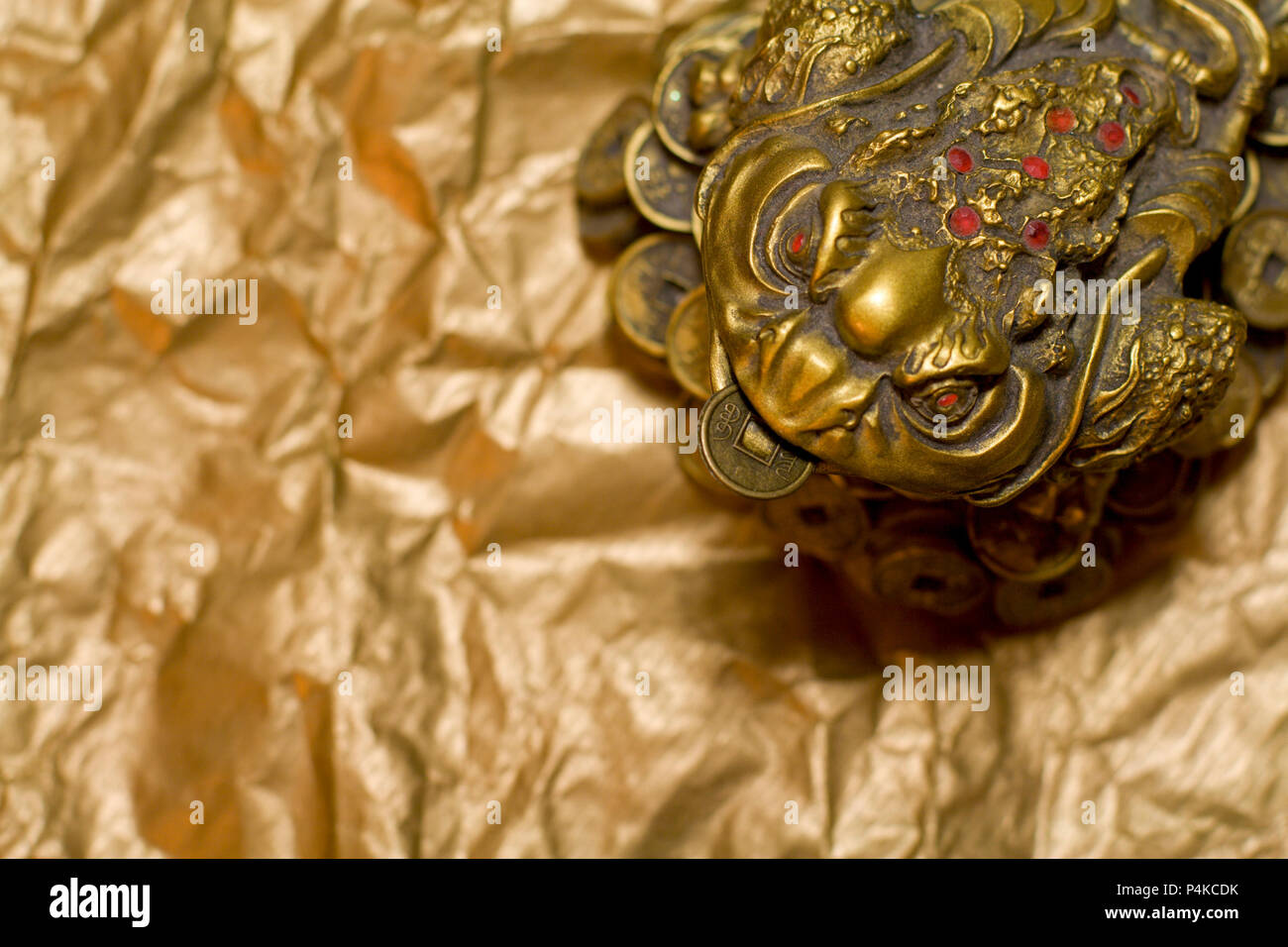 feng shui lucky money frog on golden background Stock Photo - Alamy