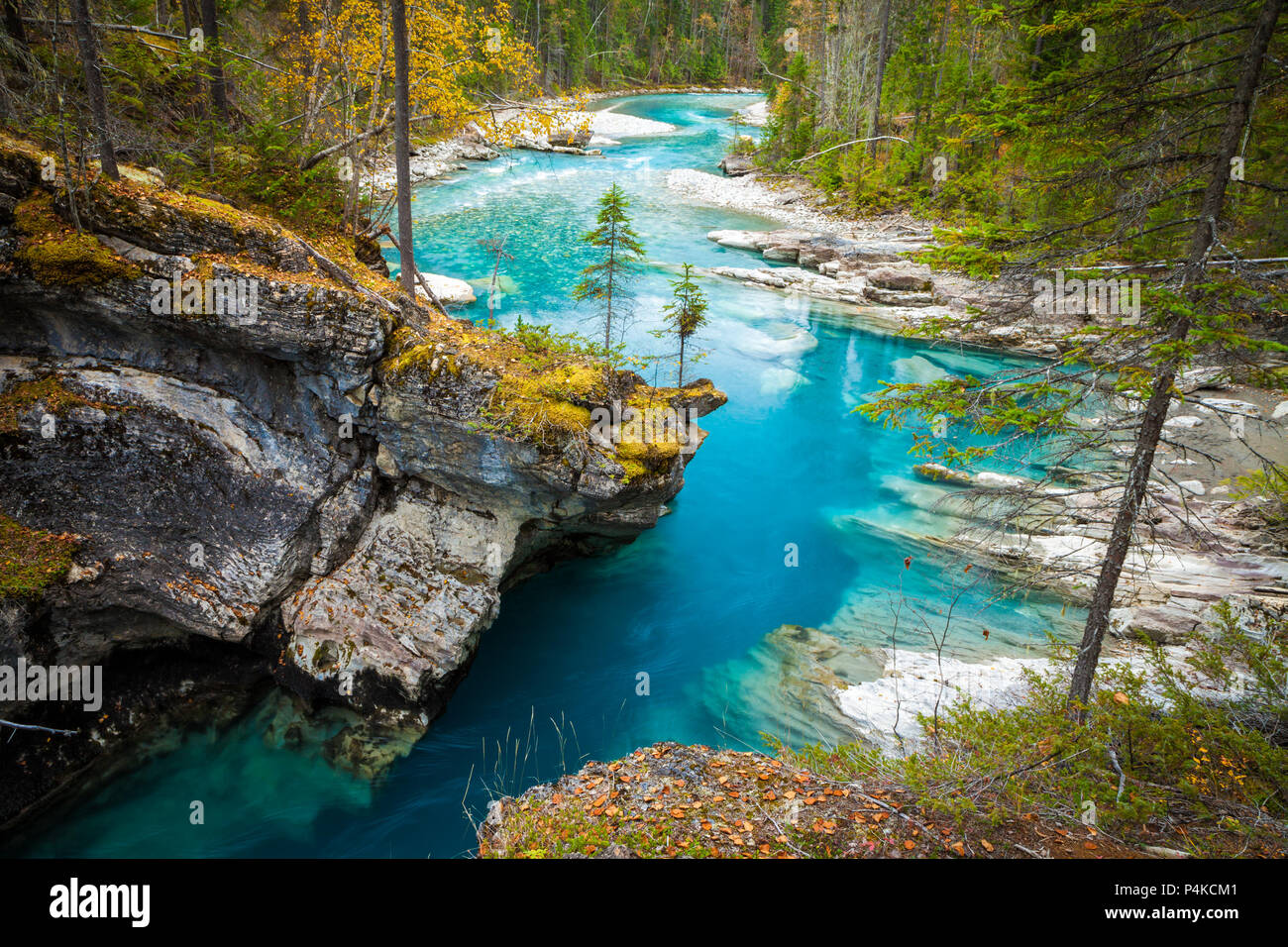 Turquoise blue river flowing through a canyon in the forest, British Columbia, Canada Stock Photo