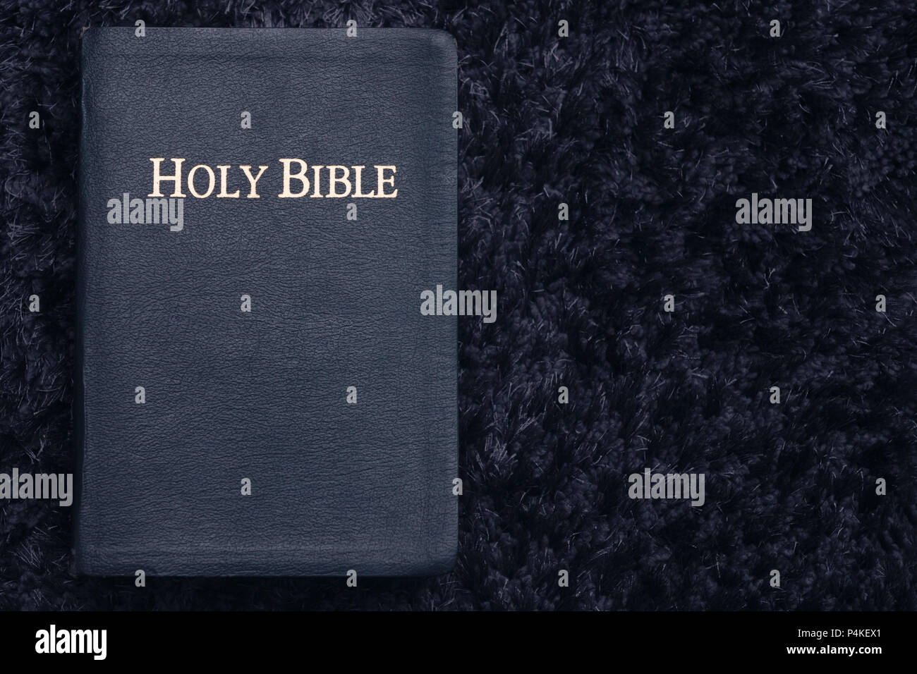 Top View of Holy Bible On Dark Texture Stock Photo