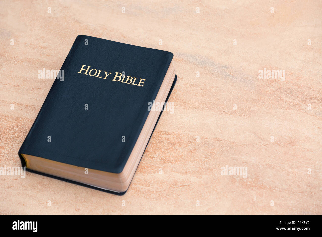 Top View of Holy Bible on Sandstone Stock Photo