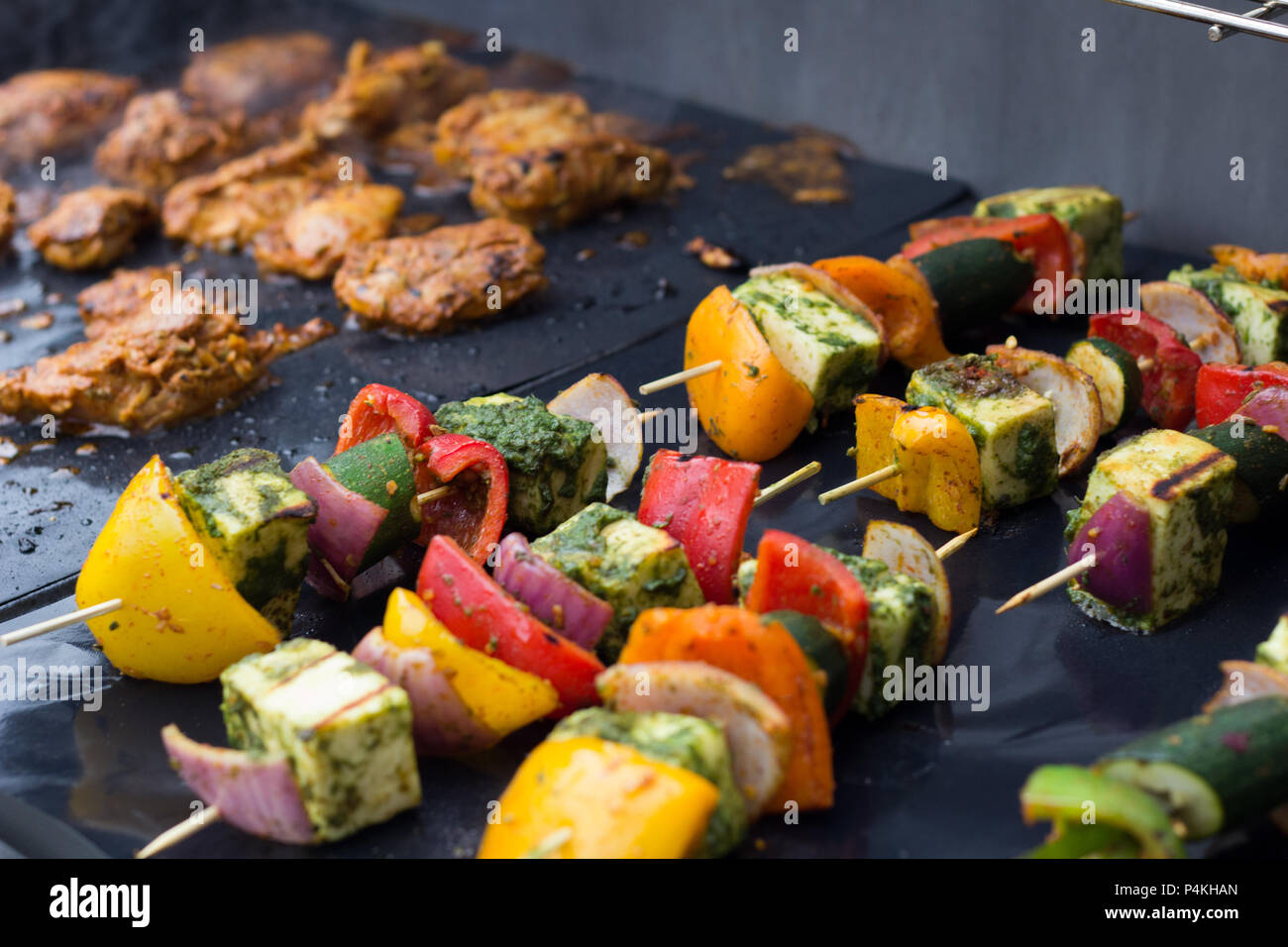 Paneer, pepper, onion skewers and grilled chicken Stock Photo Alamy