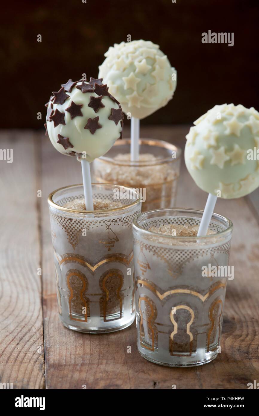 Cake pops with white chocolate icing and chocolate stars Stock Photo
