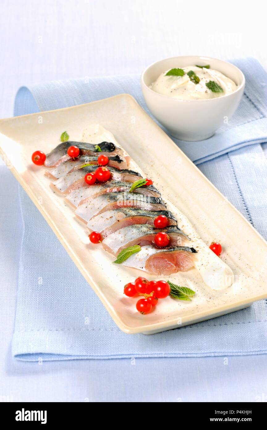 Marinated mackerel with redcurrants Stock Photo