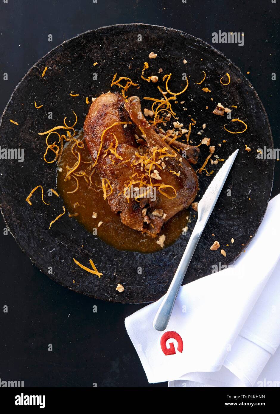 Roasted duck with orange sauce and walnuts Stock Photo