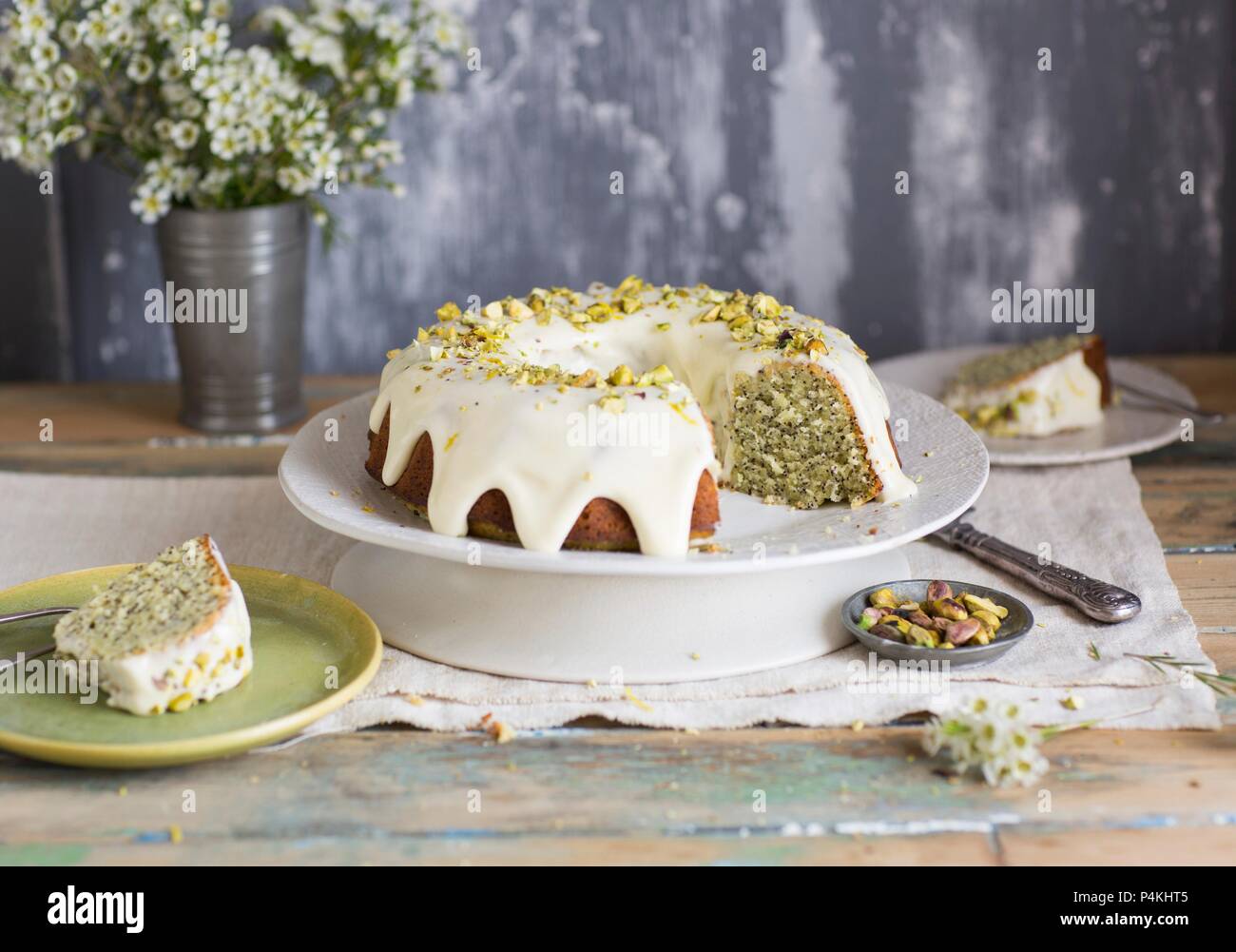 Lemon and poppy cake with pistachios, sliced Stock Photo Alamy