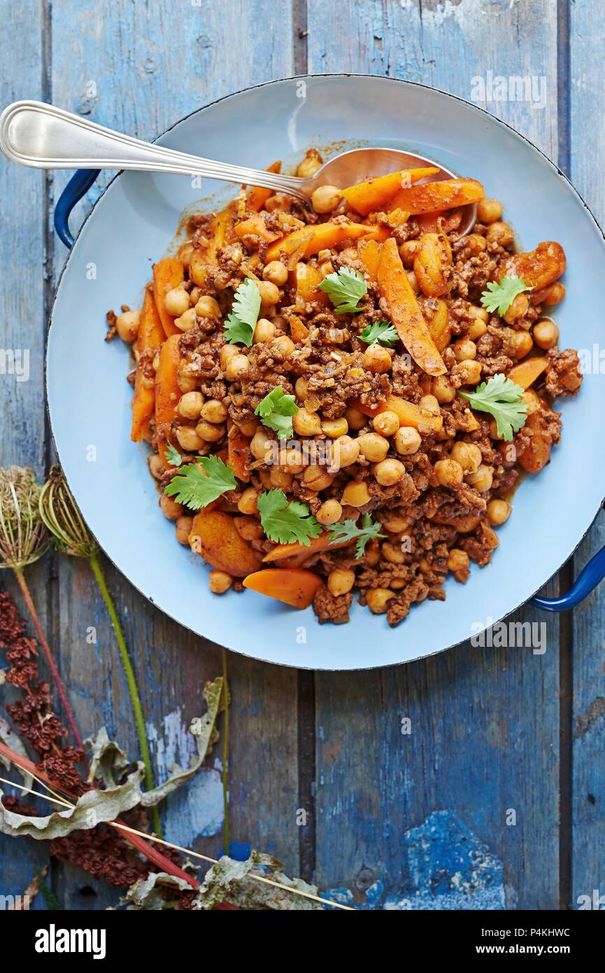 Moroccan minced lamb with chickpeas, peaches and carrots Stock Photo