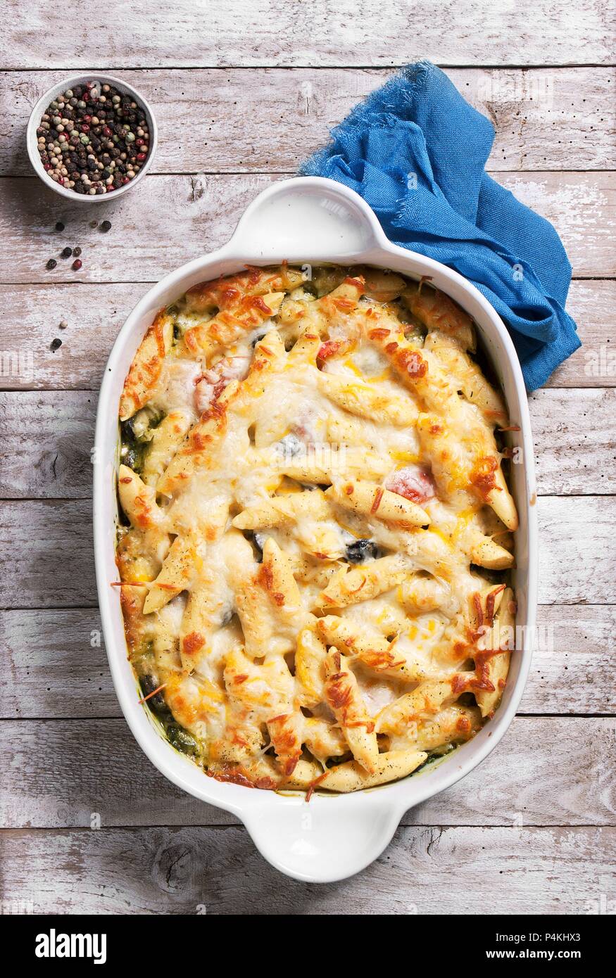 Pasta bake with cheese and spinach Stock Photo