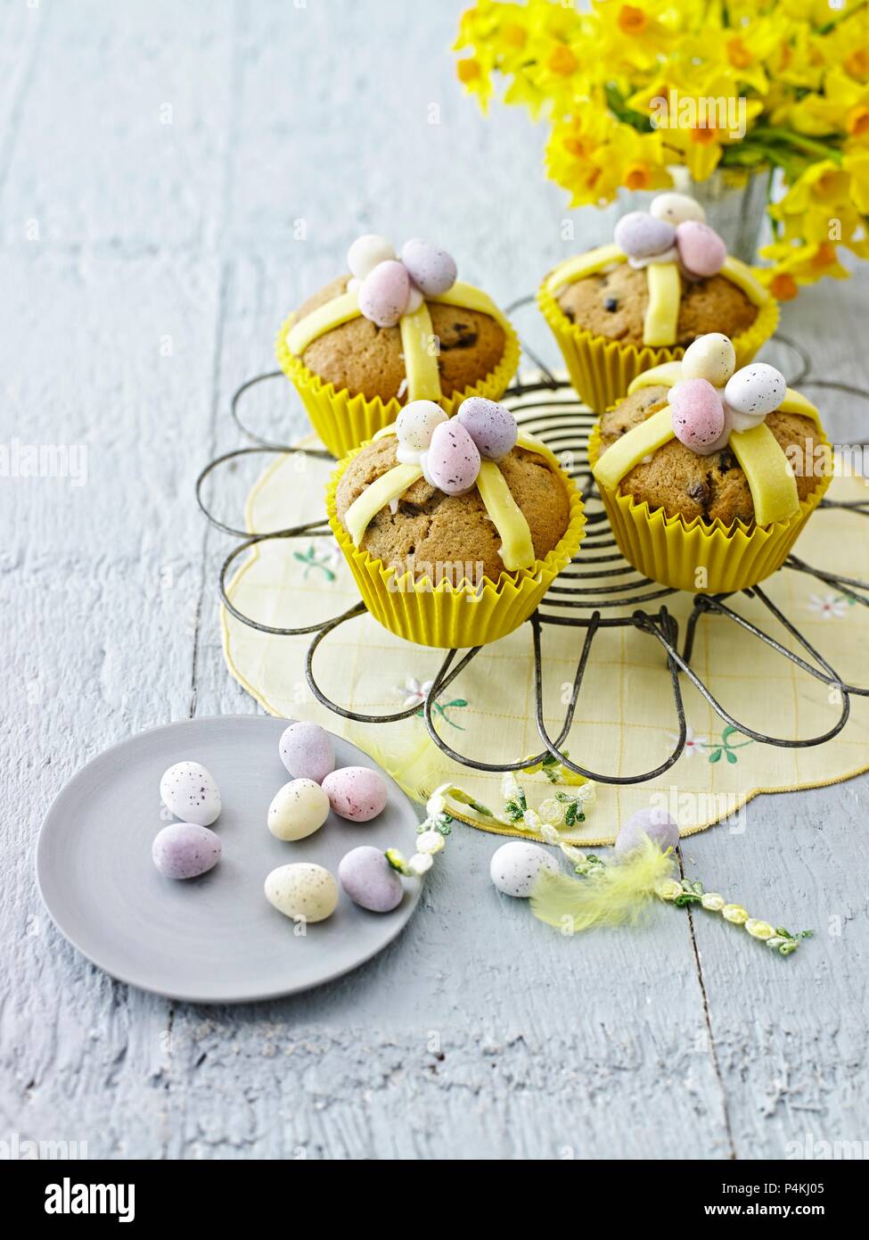 Hot cross muffin topped with chocolate mini eggs Stock Photo