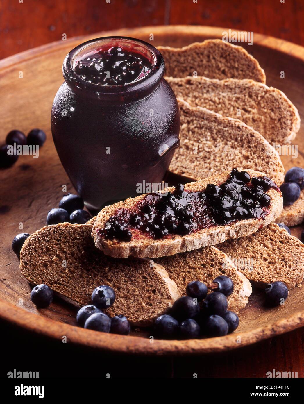 Blueberry jam on black bread Stock Photo Alamy