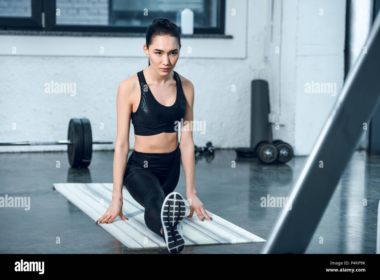 Young athletic woman stretching hi-res stock photography and images - Alamy