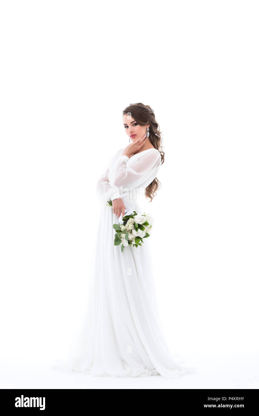 elegant bride posing in white dress with wedding bouquet, isolated on ...