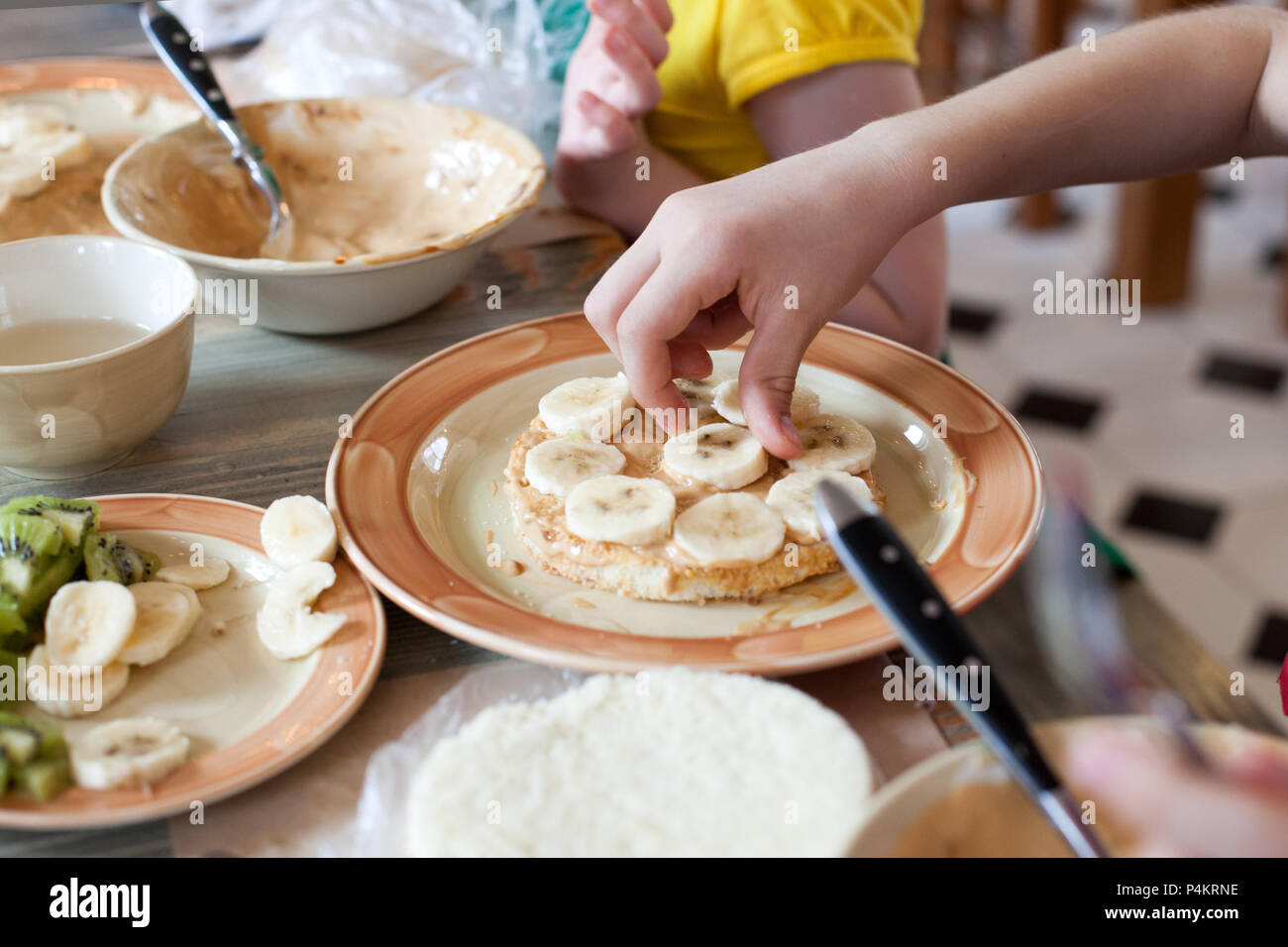 Cooking class, culinary. Food and people concept, child hands in process cooking of sweet cake. Stock Photo