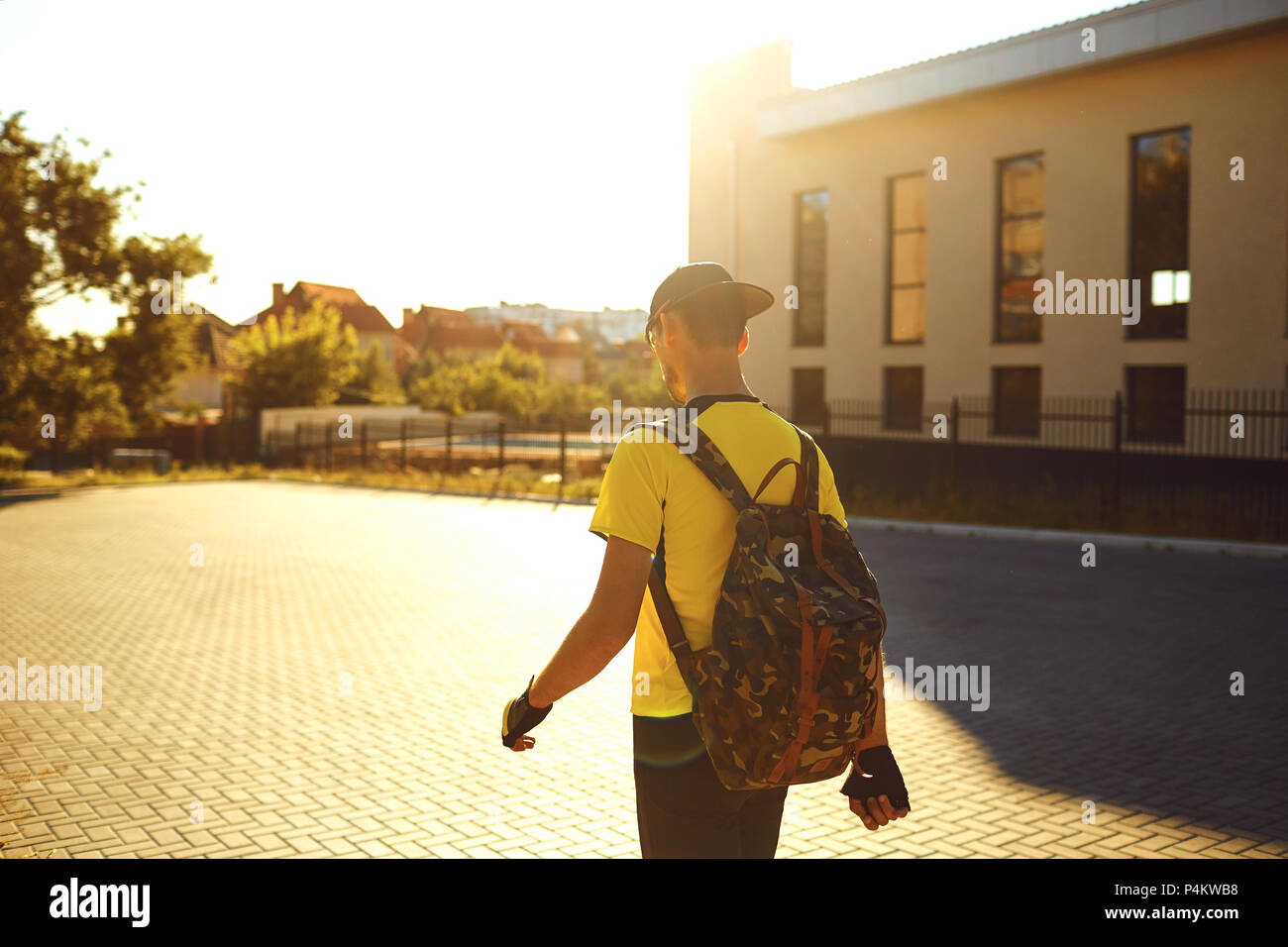 A man in sports clothes walks in the city Stock Photo