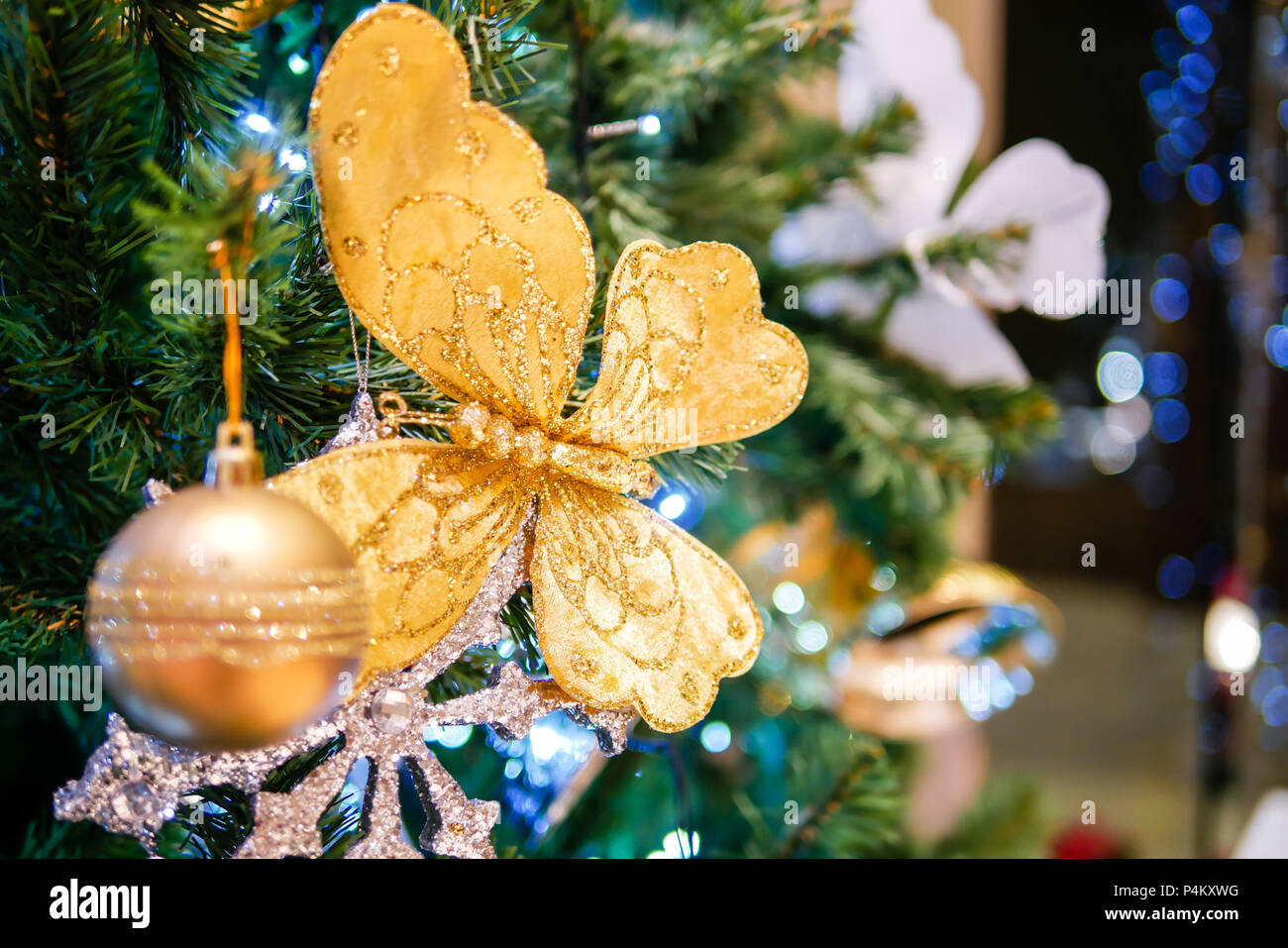 christmas tree with gold ball and butterfly glitter Stock Photo
