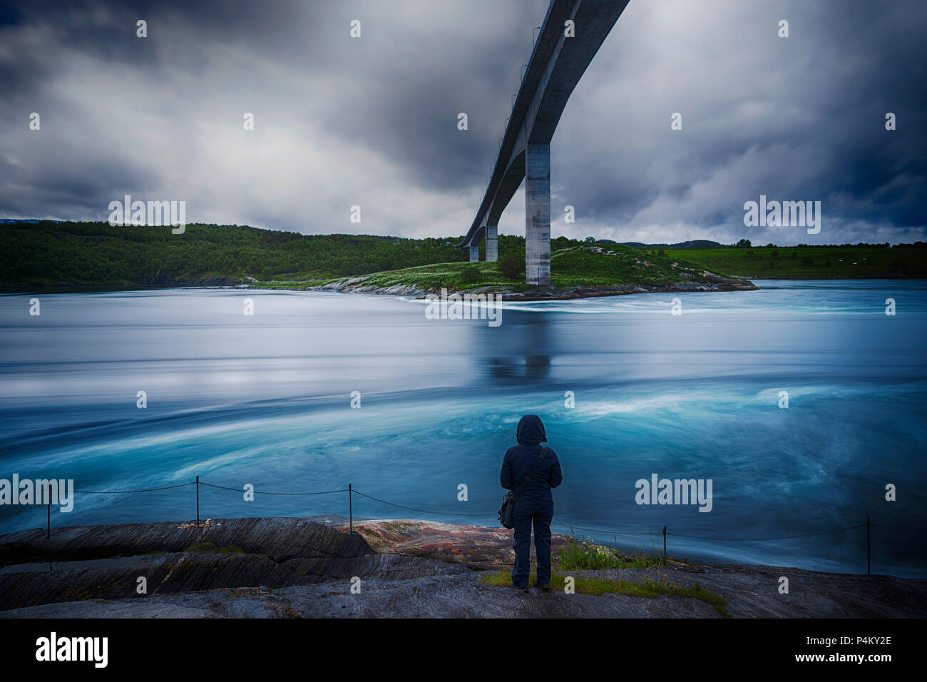 A lone figure observes the Saltstraumen, Bodo, Norway. Stock Photo