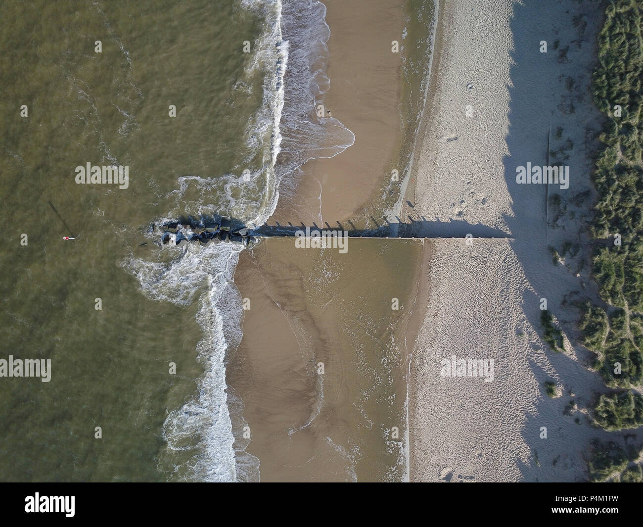 Aerial view of a groyne on a beach in the UK Stock Photo