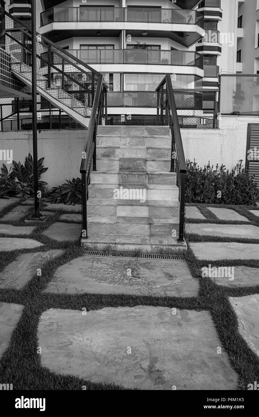 stone grass floor outdoors paving staircase mosaic white wall  black white Stock Photo