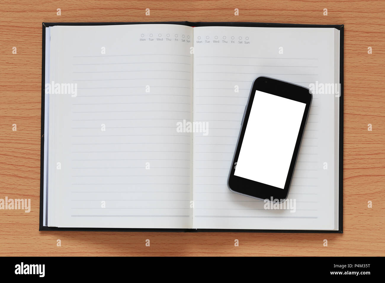 1Empty smartphone on a notebook and have copy space for design in your work concept. Stock Photo