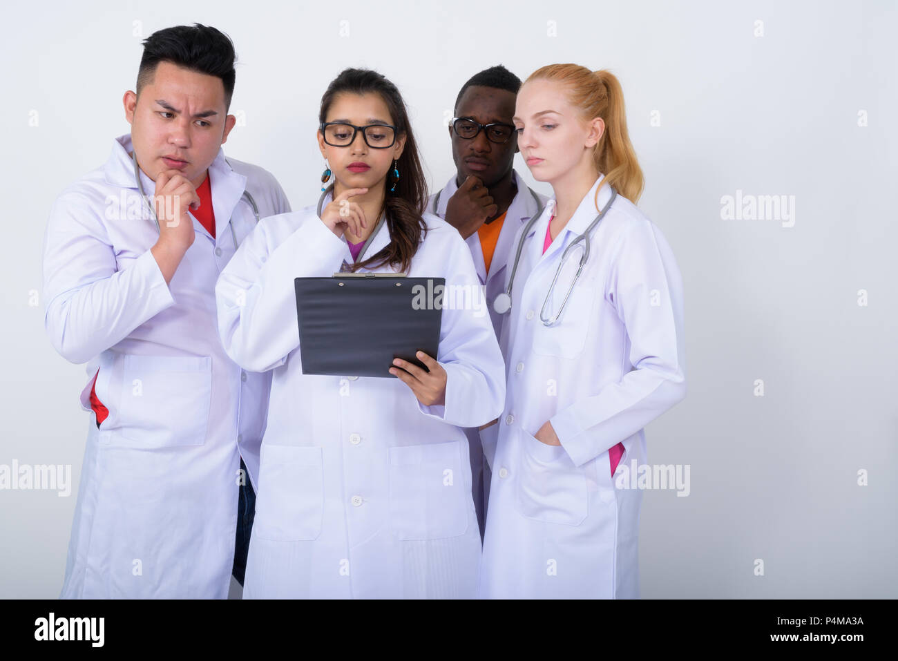 Studio shot of diverse group of multi ethnic doctors thinking wh Stock ...