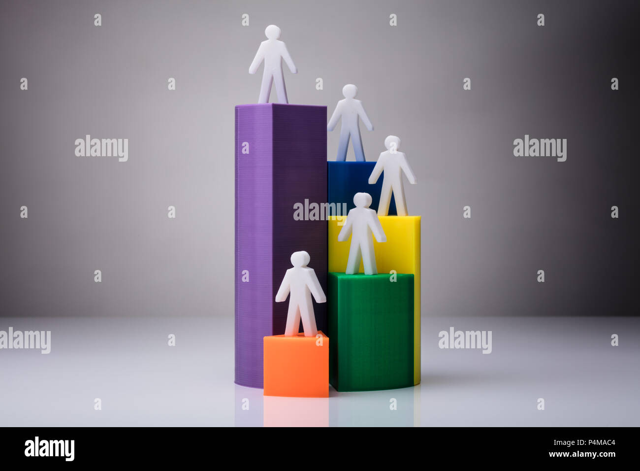 Human Figures Standing On 3D Pie Chart On White Background Stock Photo