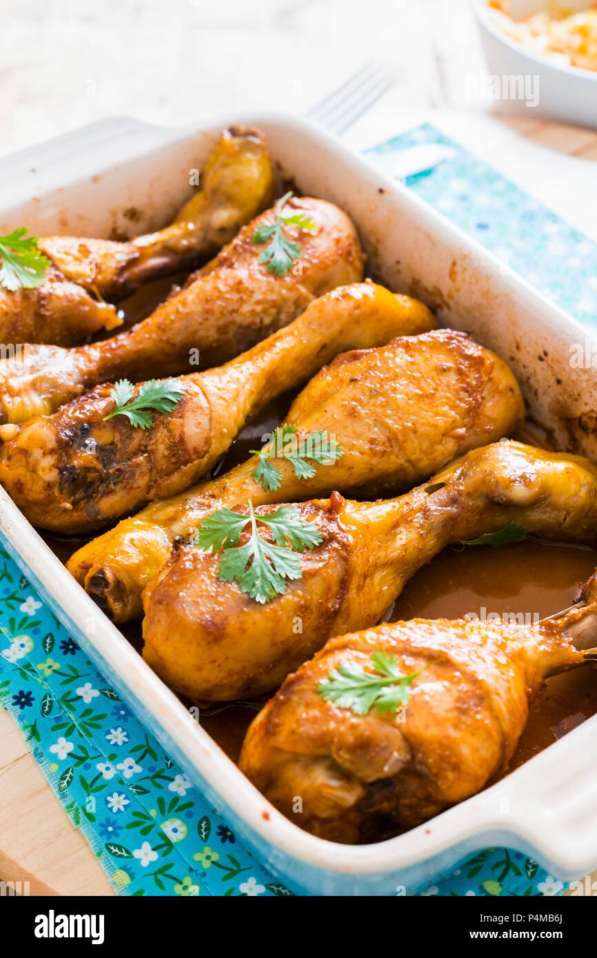 Oven-grilled chicken drumsticks with paprika Stock Photo