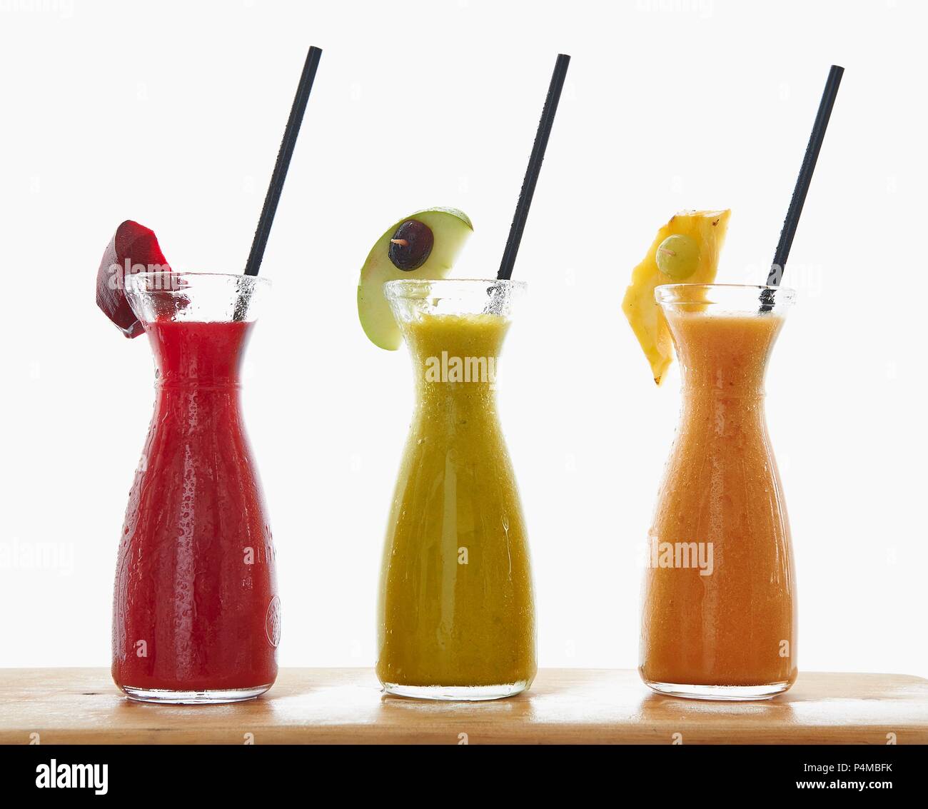 Three different smoothies in carafes Stock Photo