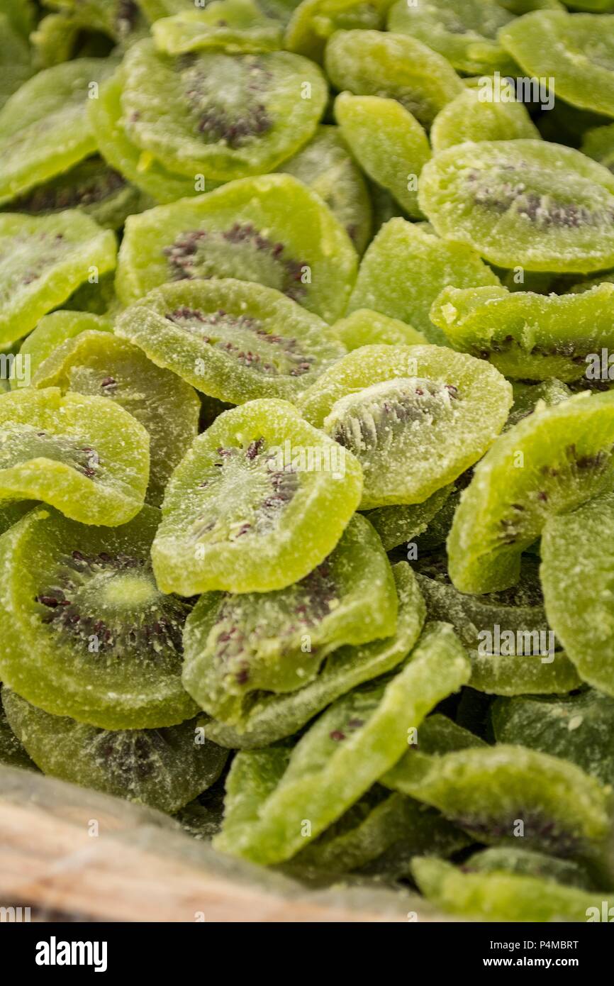 Candied kiwi for sale in a market Stock Photo