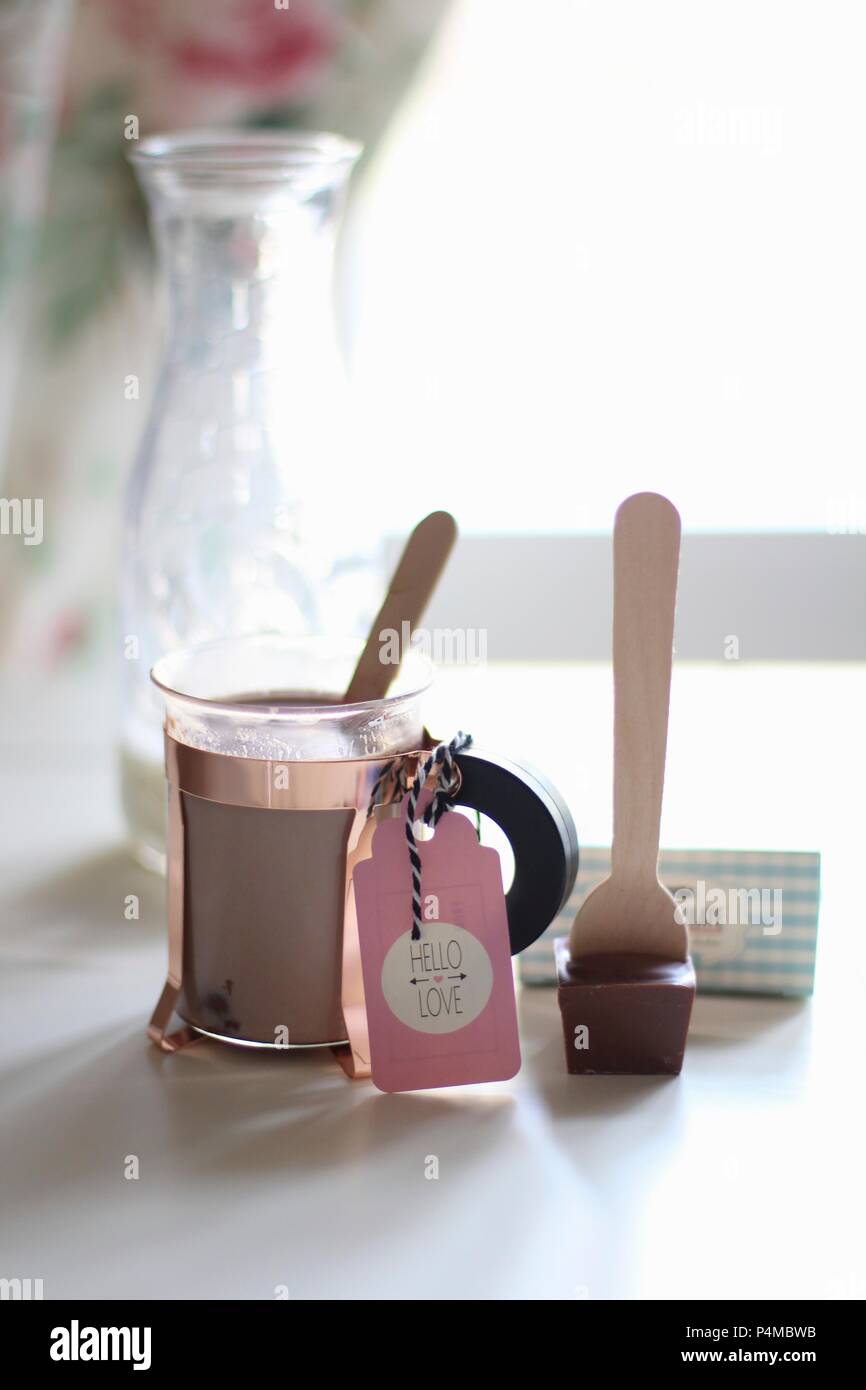 A glass of cocoa made from chocolate spoon Stock Photo Alamy