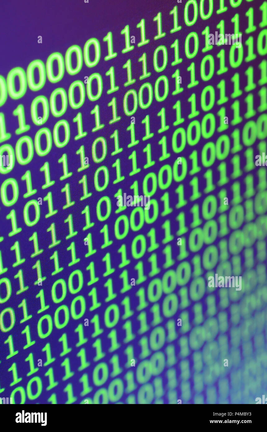 Macro shot of binary code on the monitor of an office computer. The ...