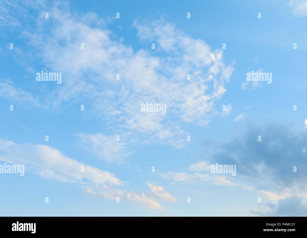 background of fluffy clouds moving over blue sky in a sunny day with copy space. Stock Photo