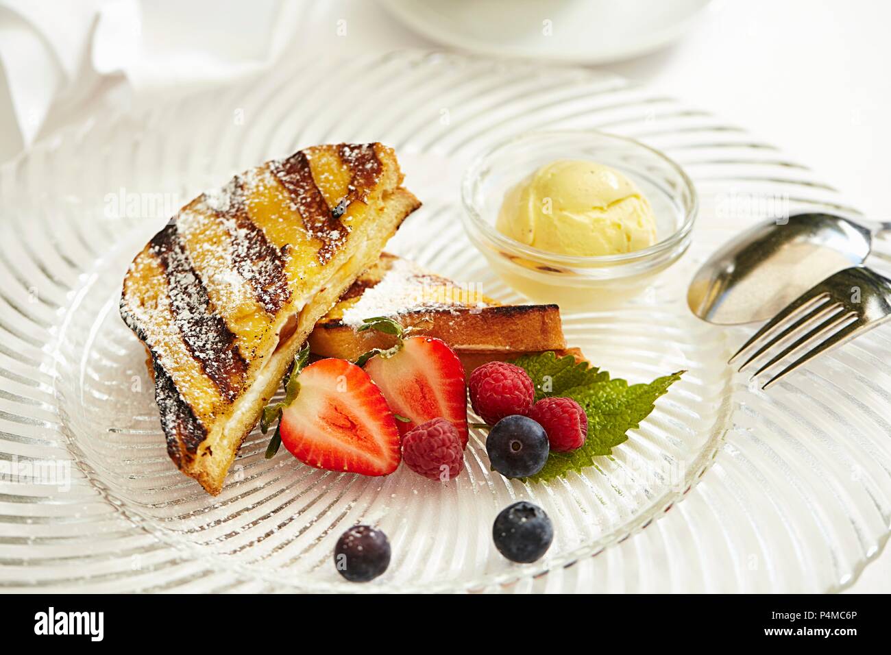 Grilled French toast with fruit and vanilla ice cream Stock Photo