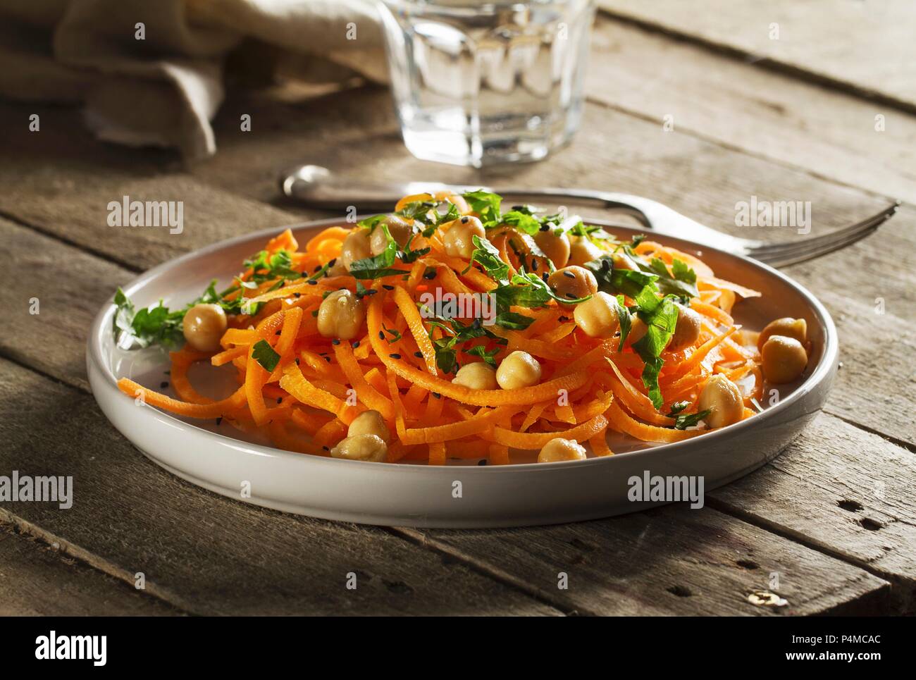 Vegetable salad with carrot, chickpeas and parsley Stock Photo