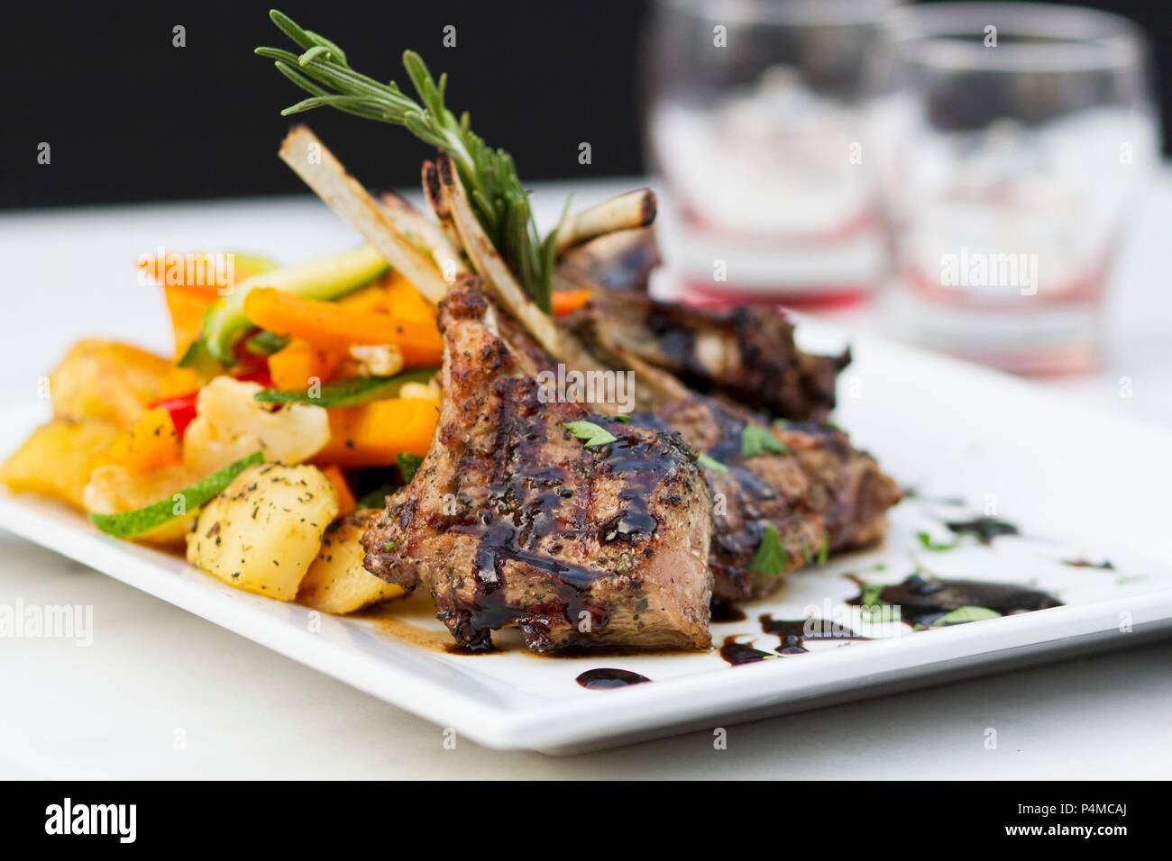 Grilled lamb chops with a side of vegetables Stock Photo - Alamy