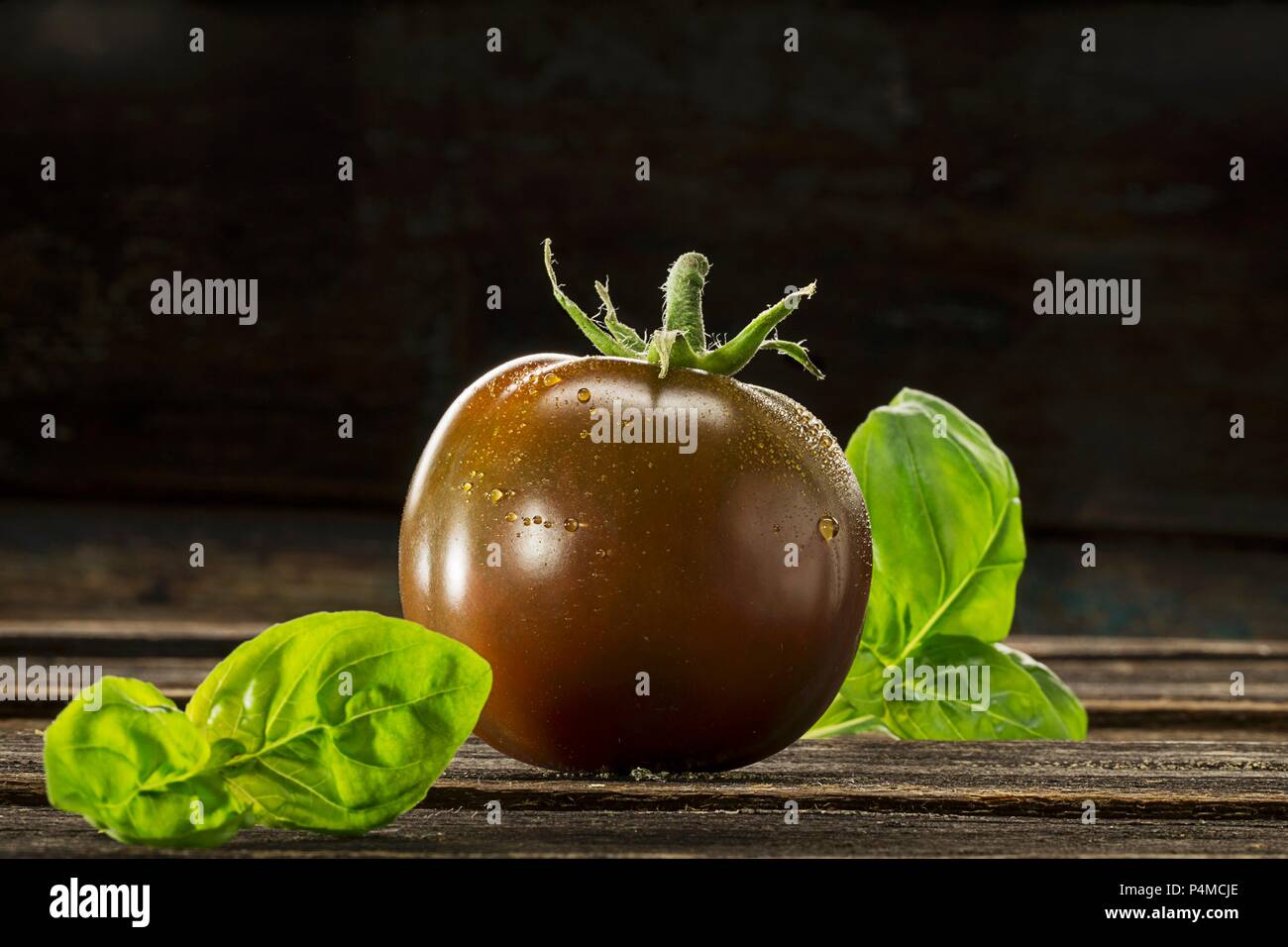 Kumato tomato and basil Stock Photo