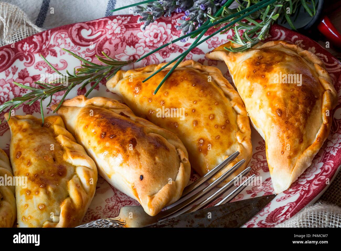 A plate of Spanish pasties filled with meat and tuna Stock Photo