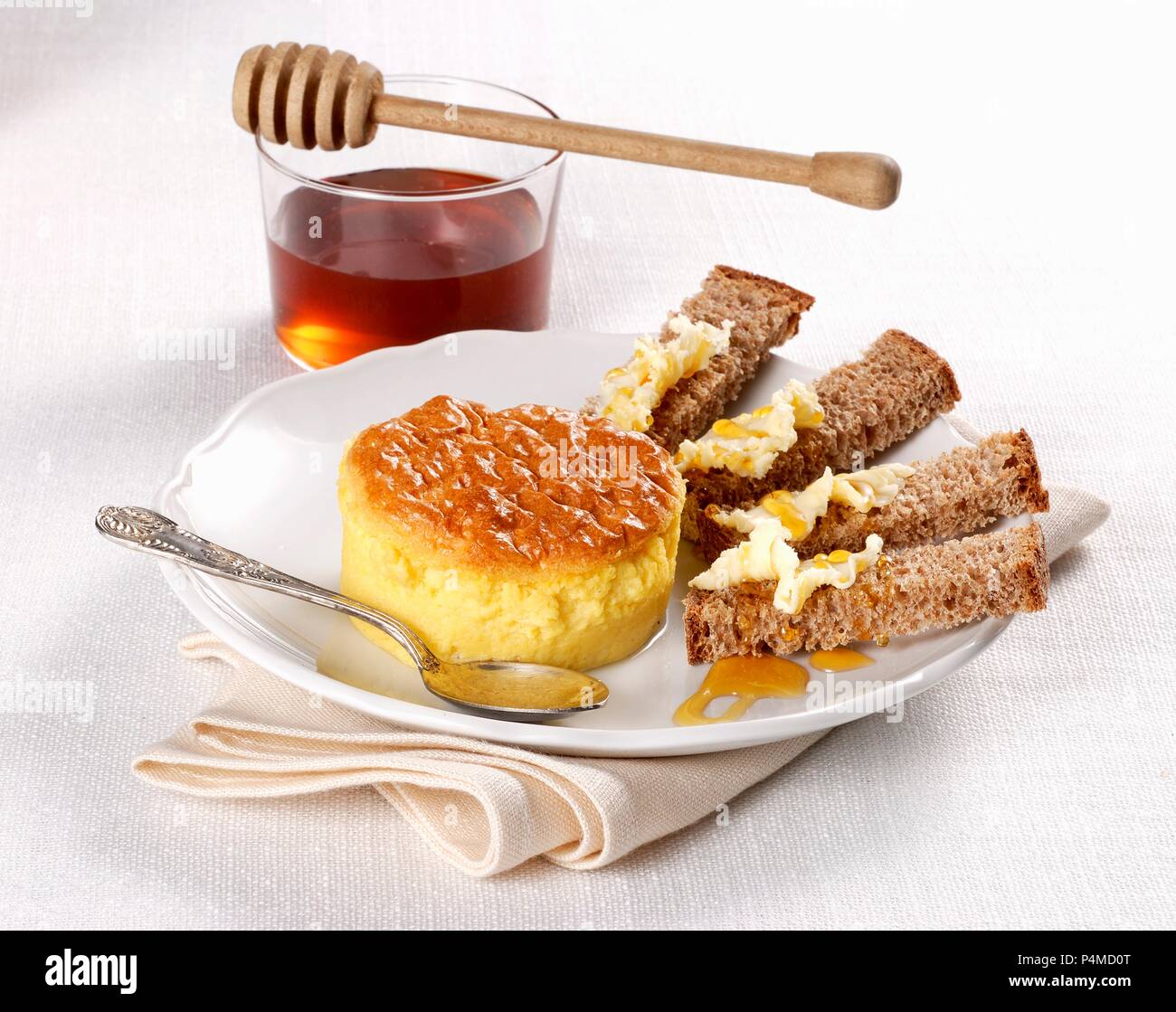 Sformatino al formaggio (an Italian cheese flan with bread and honey) Stock Photo
