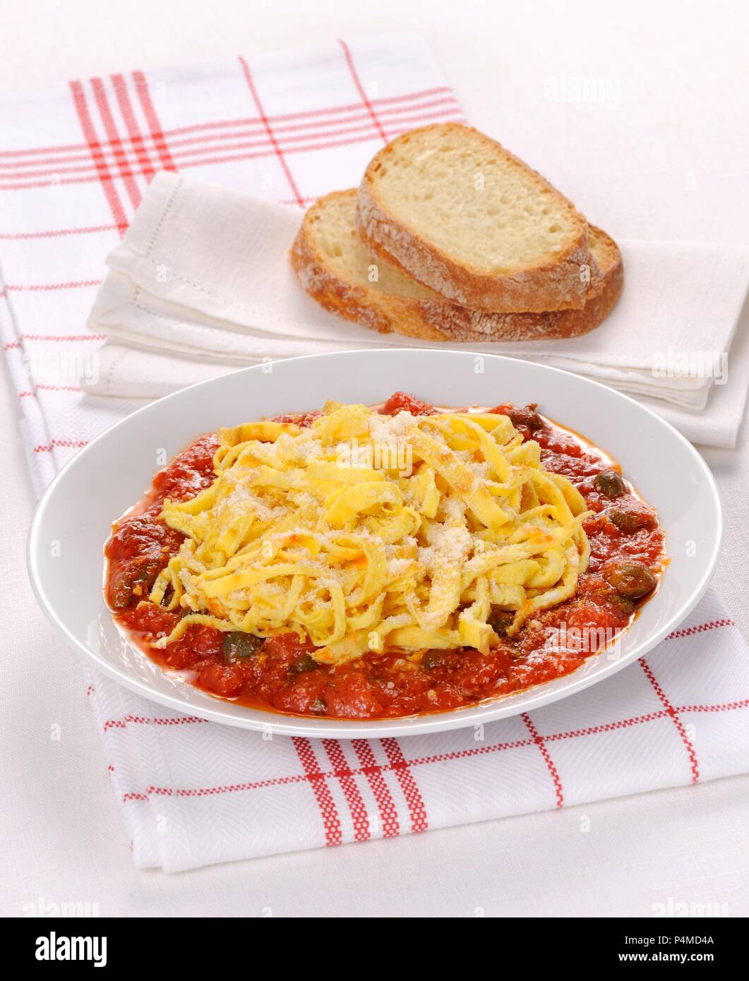Uova in Trippa (Italian omelette strips in tomato sauce) Stock Photo