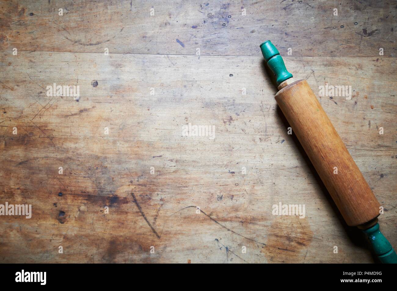A Rolling Pin on a Wooden Table; From Above Stock Photo