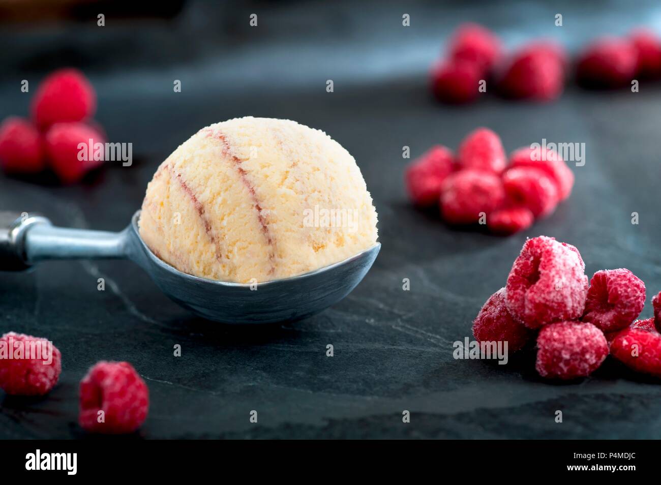 Raspberry ice cream and frozen raspberries Stock Photo