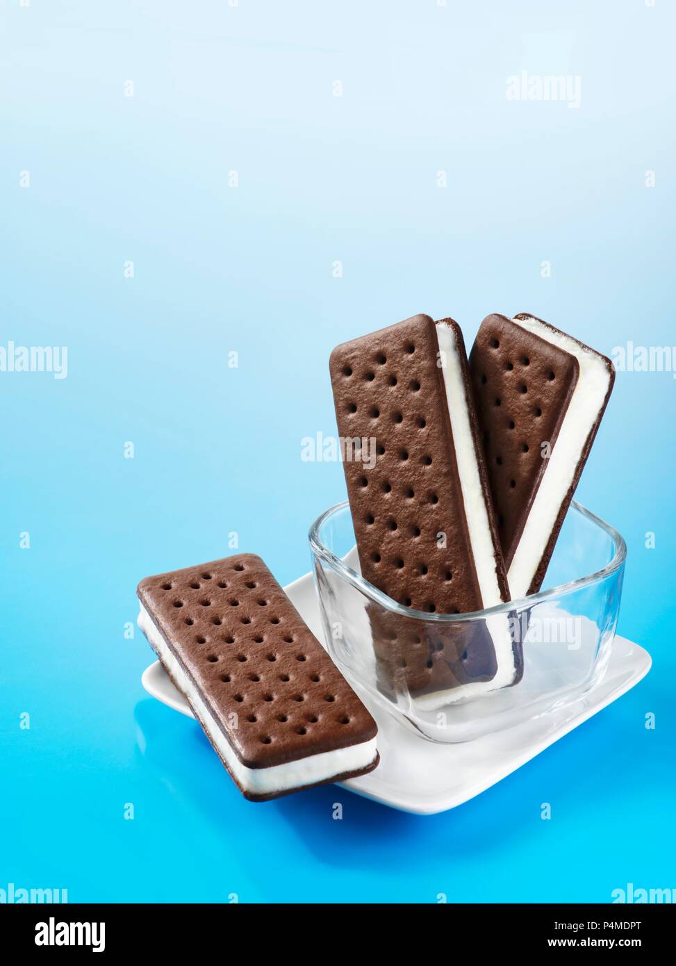 Ice cream sandwiches in a glass dish and on a plate Stock Photo
