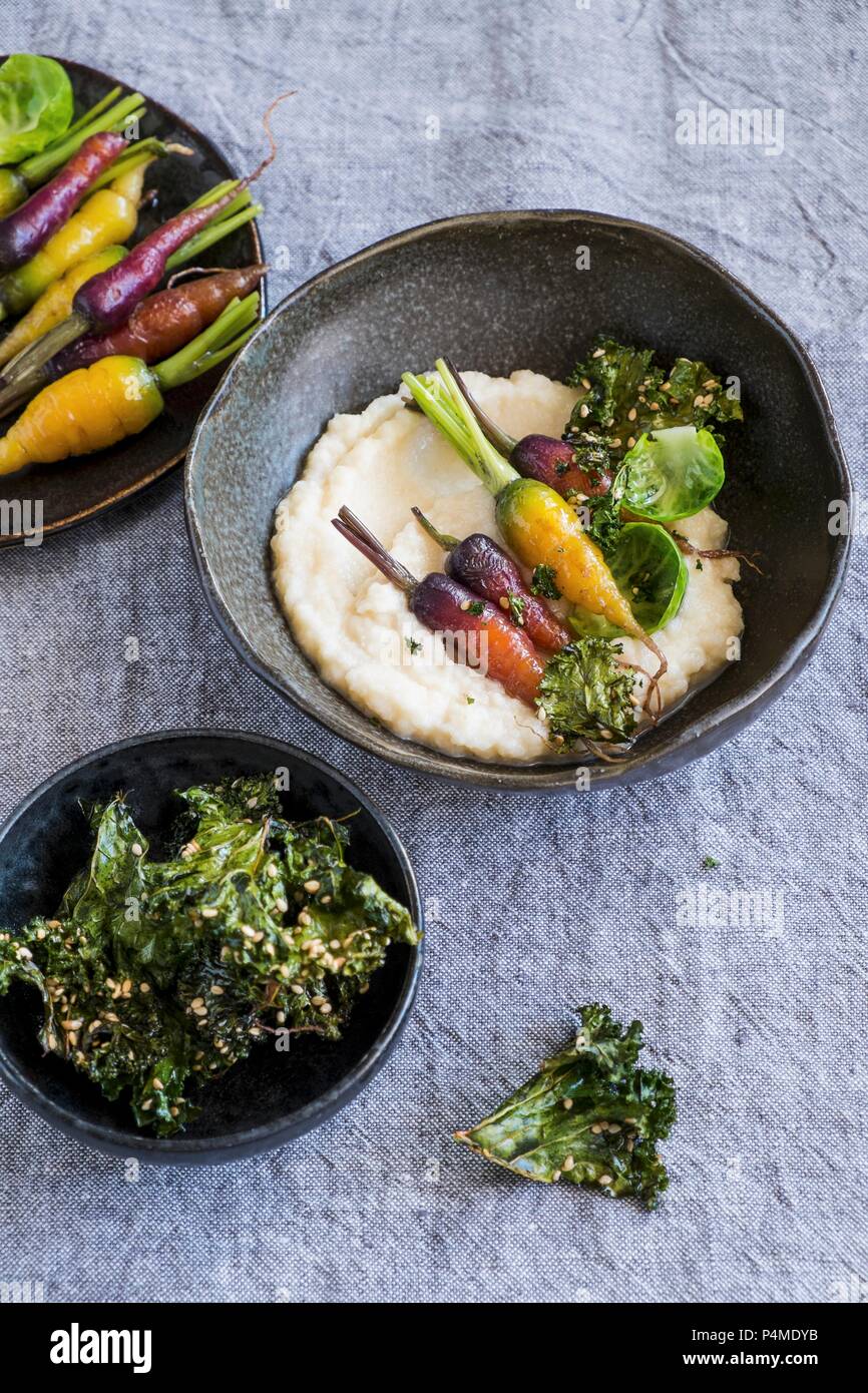 Celeriac puree with roasted carrots and kale Stock Photo Alamy
