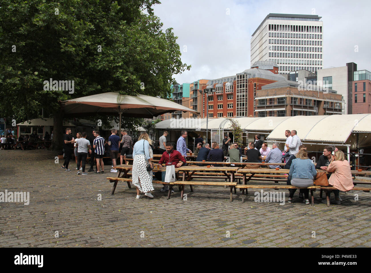People drinking together at Queen Square, Bristol, England. Stock Photo