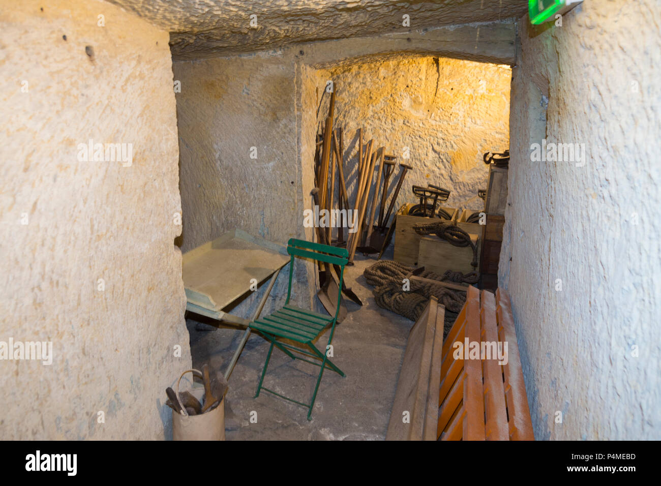 Store room / storage area / stores of tools in the air raid shelter tunnel / tunnels inside / underground at the Malta At War Museum, Malta. (91) Stock Photo