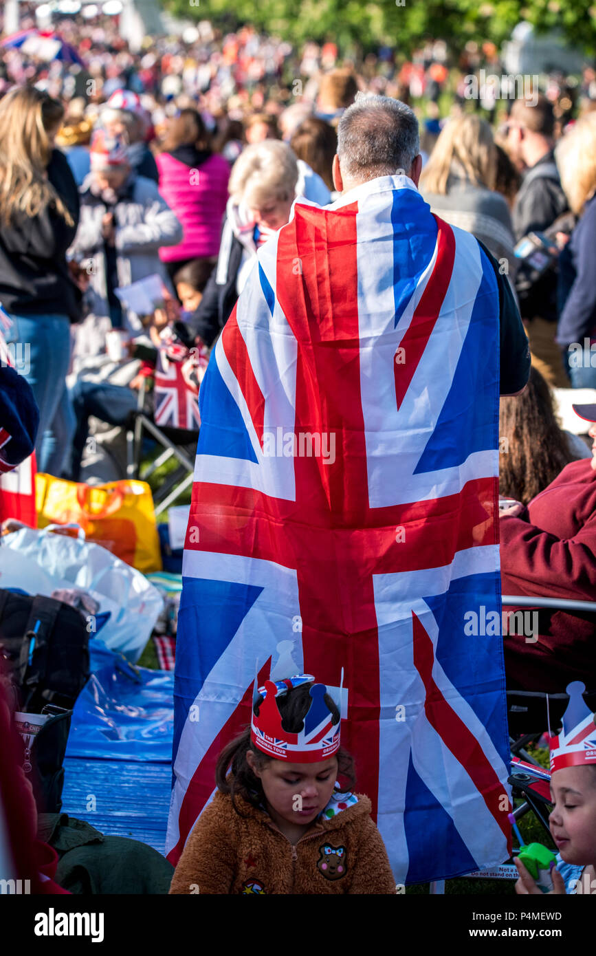 Crowds in Windsor and along the Long Walk wear extreme and patriotic outfits on the morning of the royal wedding of HRH Prince Harry and Ms. Meghan Markle. Many of the outfits seen feature the union jack, with red, white and blue being the main colour scheme seen. Stock Photo