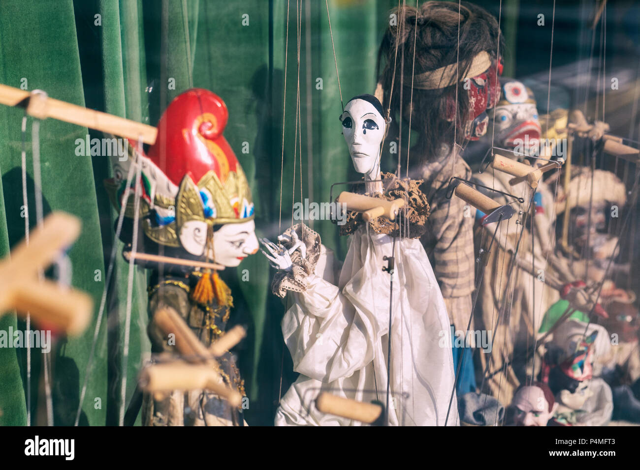 Marionettes in a window. Shipston on stour, Warwickshire, England. Vintage filter applied Stock Photo